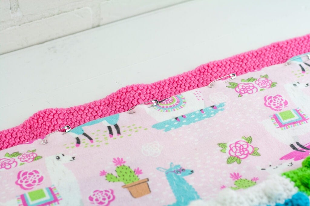Learn to line a crochet blanket with fabric. This written and video tutorial will show you how to sew a liner in by hand or sewing machine.