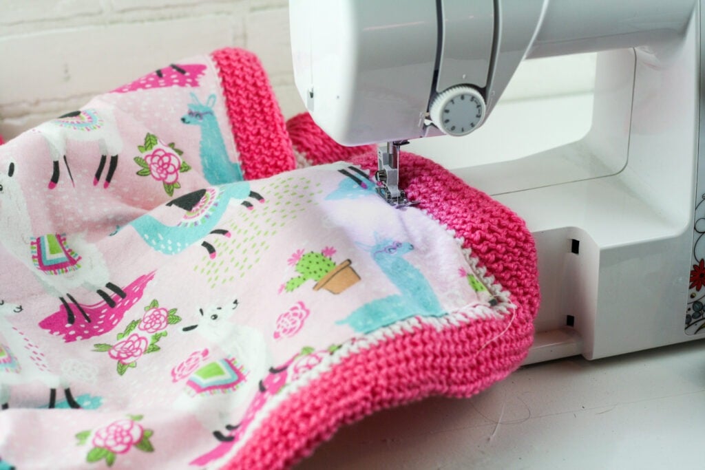 Learn to line a crochet blanket with fabric. This written and video tutorial will show you how to sew a liner in by hand or sewing machine.