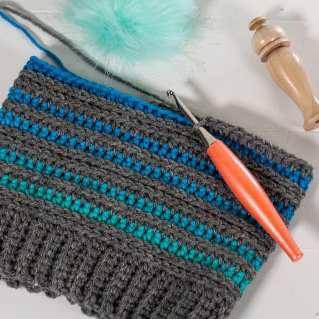 You will love the prismatic crochet beanie pattern and its balance of color. It works up quickly and has a helpful video tutorial.