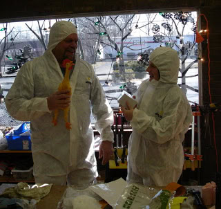 The rubber chickens and moon suits arrive.