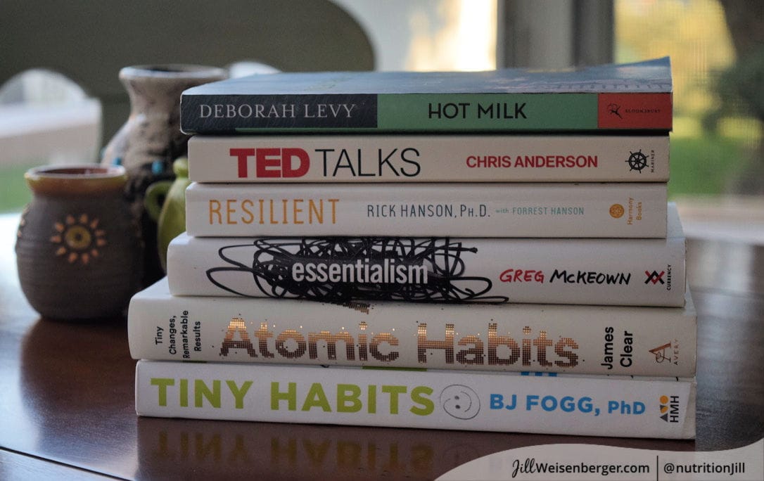 Stack of books on patio table