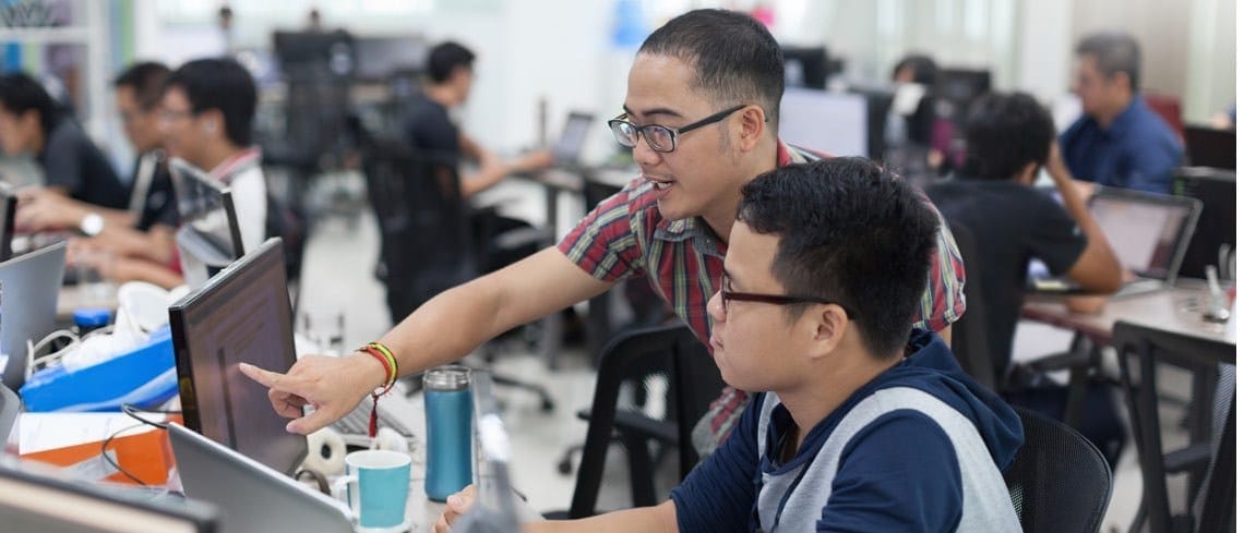 Students working on a screen