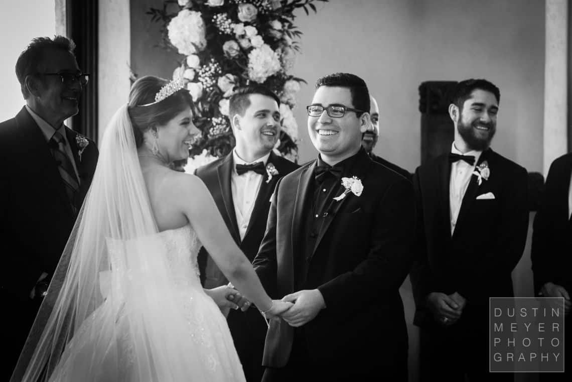 A candid photojournalism picture of the wedding bride and groom excited about their marriage.