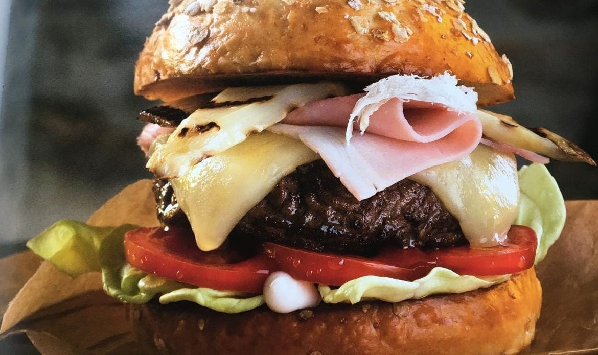 A close up of a burger