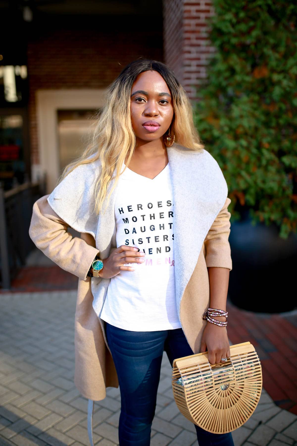 The easiest way to dress up your t-shirt and jeans outfit is to pair with a fitted tee, skinny jeans without excess embellishments, and a pair of ballet flats or slides. Throw on a clean black or denim blazer and be ready to conquer the world.