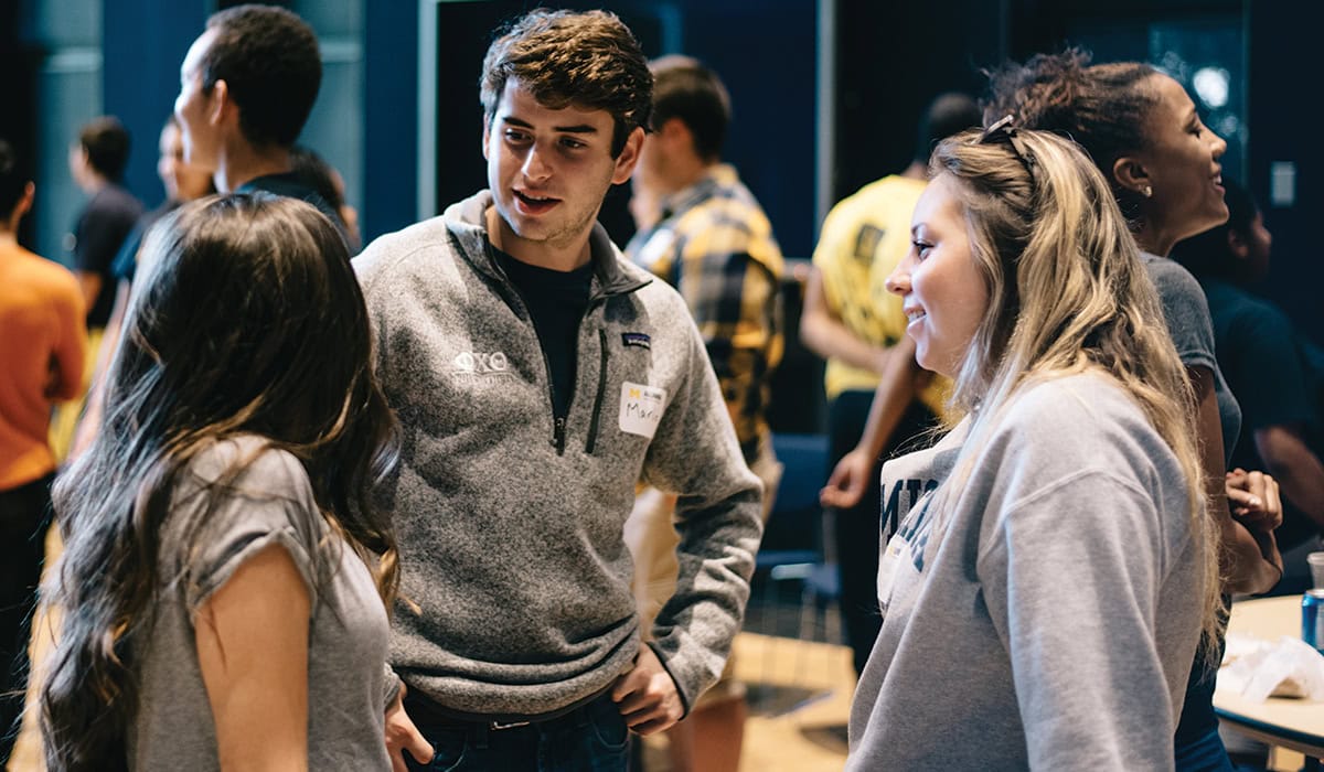 Students talking at the Alumni Center at the University of Michigan in Ann Arbor