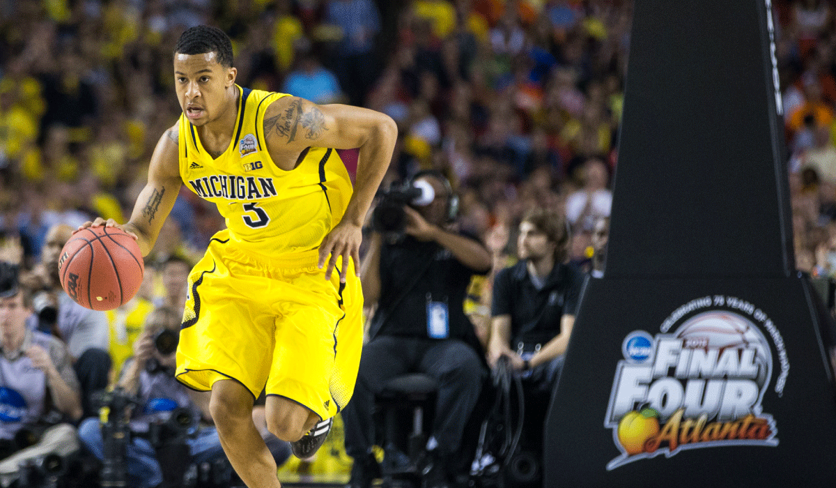 Michigan basketball's Trey Burke dribbles at the Final Four
