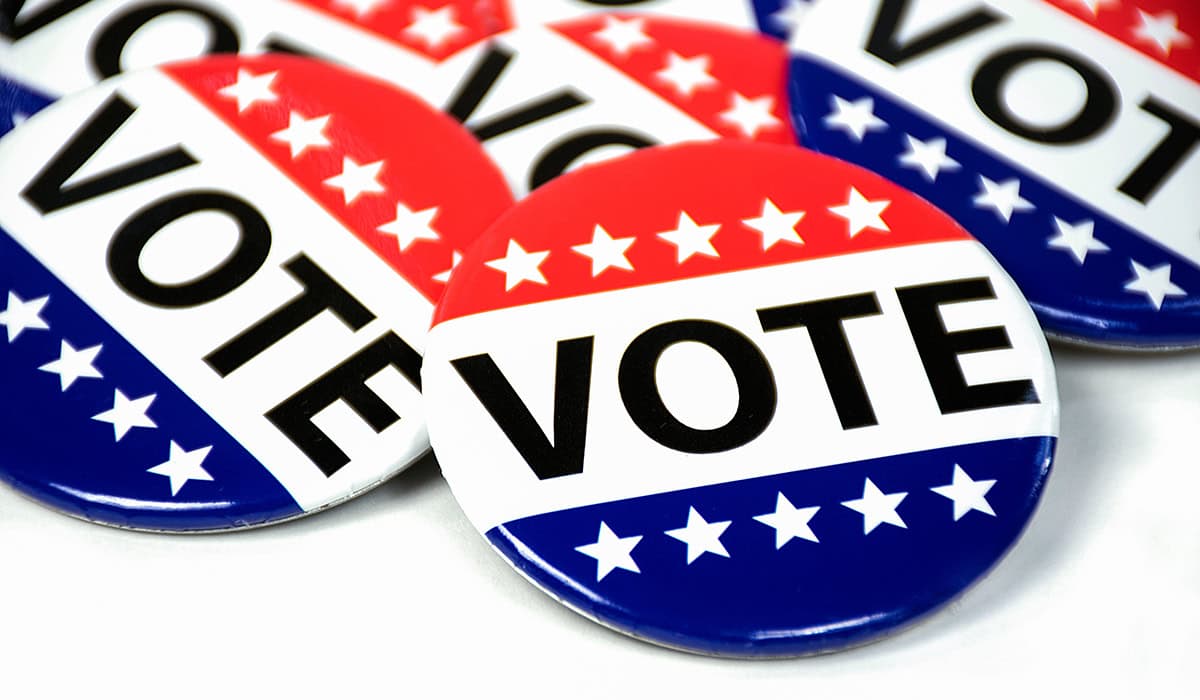 Close Up Of Campaign Voting Flag Pins On White