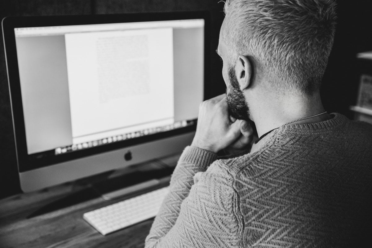 adam answering emails during his pr branding photoshoot