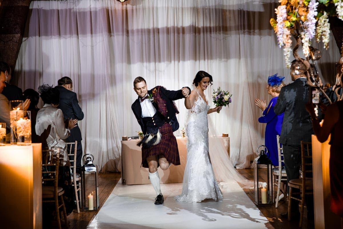 celebrating by dancing down the asile