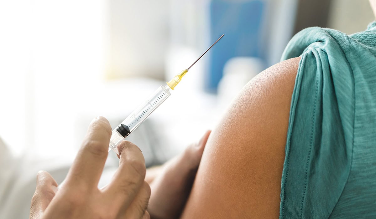 Vaccine Or Flu Shot In Injection Needle. Doctor Working With Patient's Arm. Physician Or Nurse Giving Vaccination And Immunity To Virus, Influenza Or HPV With Syringe.