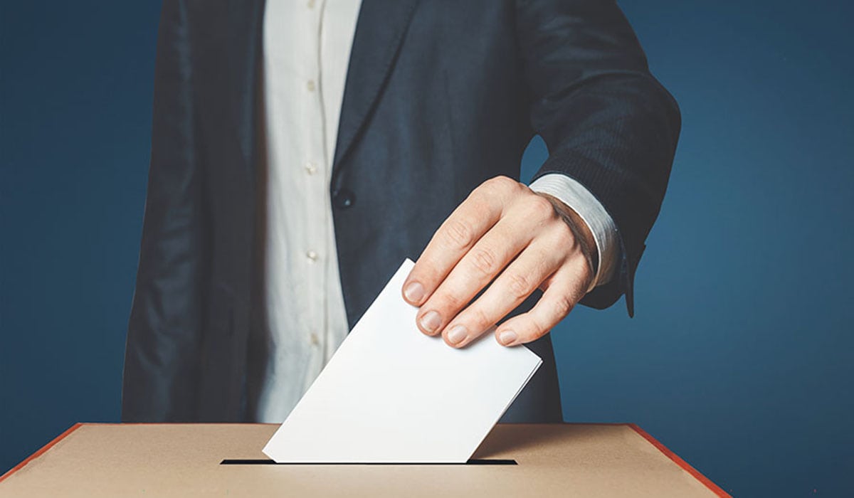 Man Voter Putting Ballot Into Voting Box. Democracy Freedom Concept