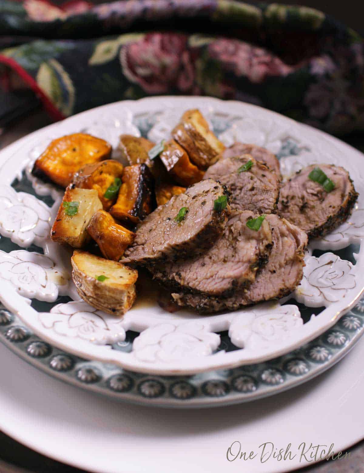sliced pork tenderloin on a plate | one dish kitchen