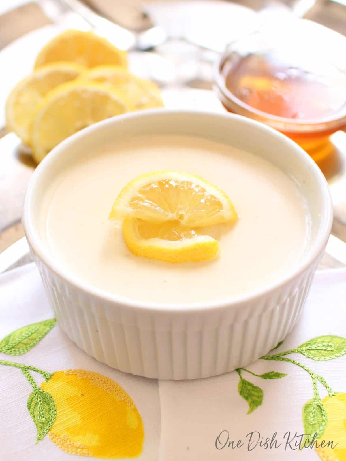 a honey lemon posset in a bowl on a tray | One dish kitchen