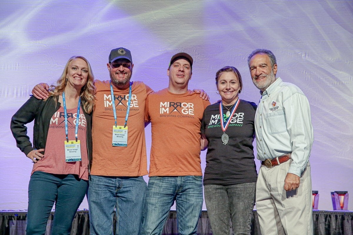 Mirror Image Brewing Company accepts their first GABF award at the Great American Beer Festival (GABF) 2019