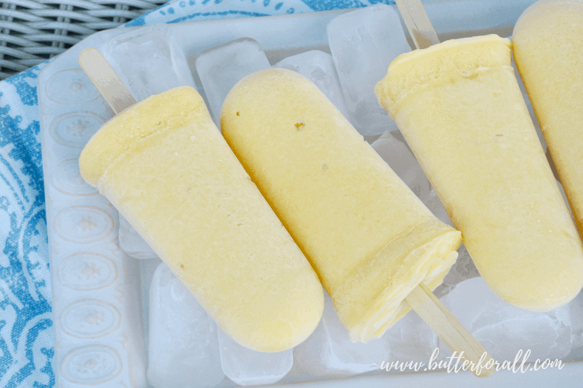 Summer is the season for popsicles. Make them right with probiotic Coconut Yogurt, fresh fruit, and unrefined sweetener! #realfood #fermented #probiotic #mangolassi #dairyfree #coconut #healthyfat #nourishing #wisetraditions #summer #Popsicles #fruit #yogurt