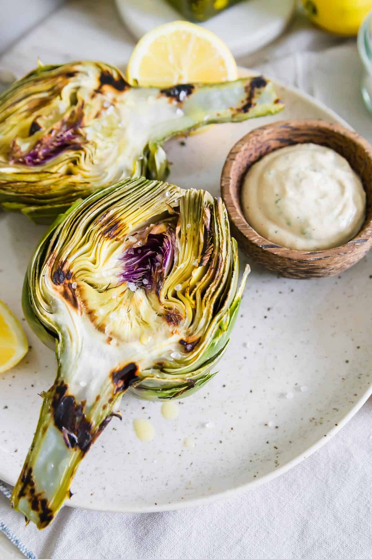 Simple Grilled Artichokes with Lemon Herb Tahini Dipping Sauce