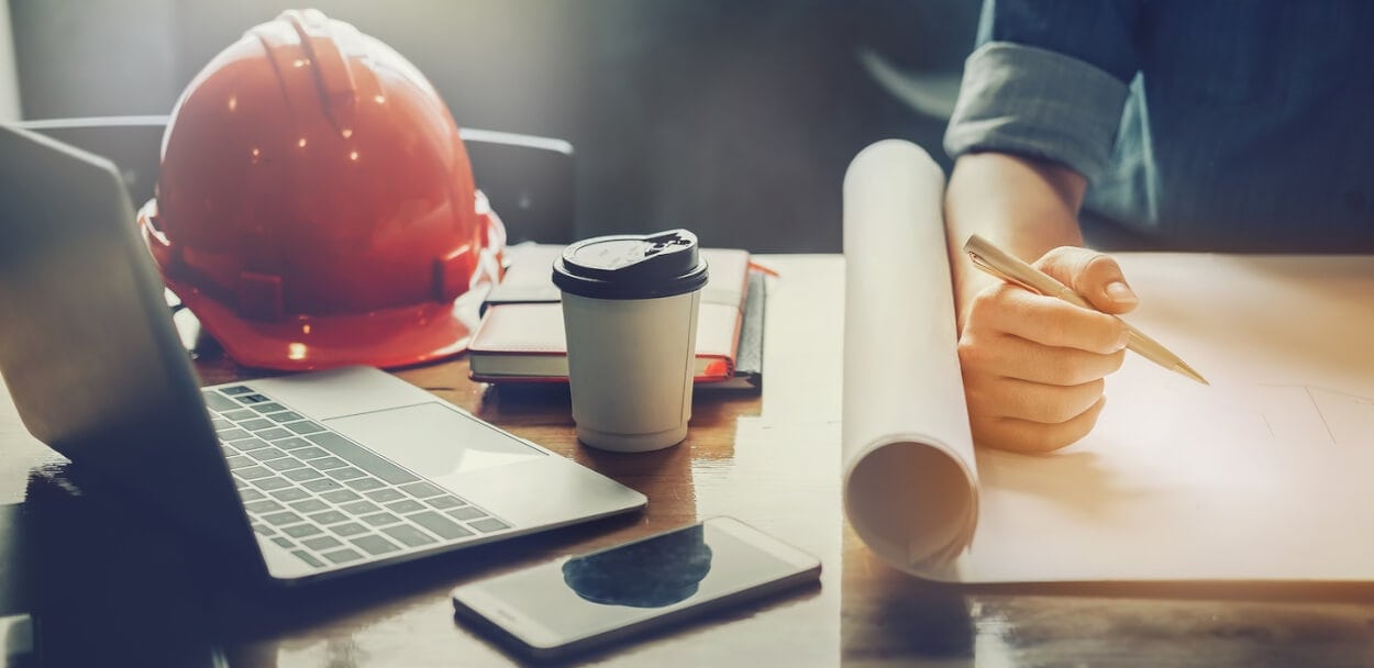Contractor working on plan and estimate.jpg
