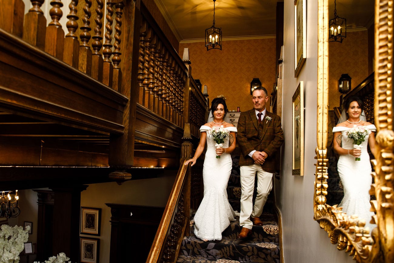 bride walking down stairs at inglewood manor