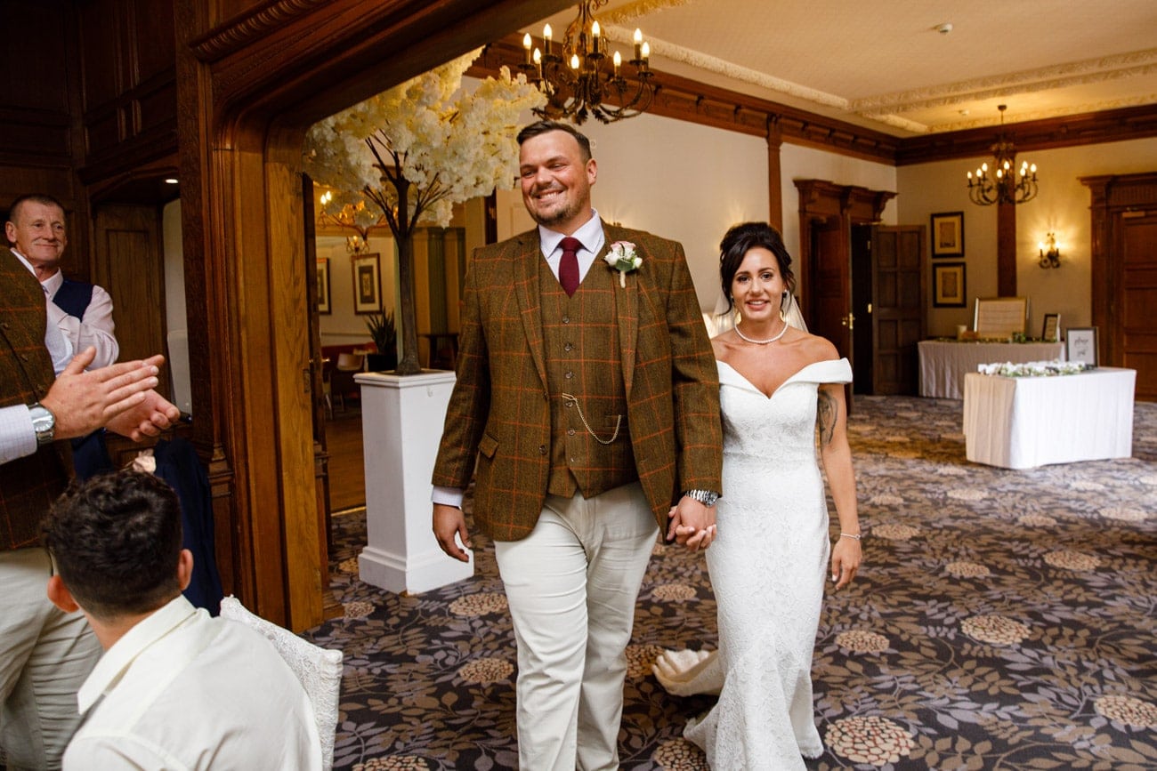 bride and groom entering the room at inglewood manor