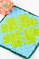 Crochet a quick Corner to corner crochet wash cloth or pot holder using this small Four Leaf Clover C2C graph. This graph works up quickly and is designed to c2c beginners. Get the graph, written chart and suggestions for using yarn bobbins. #c2ccrochet #crochetwashcloth #crochetpotholder