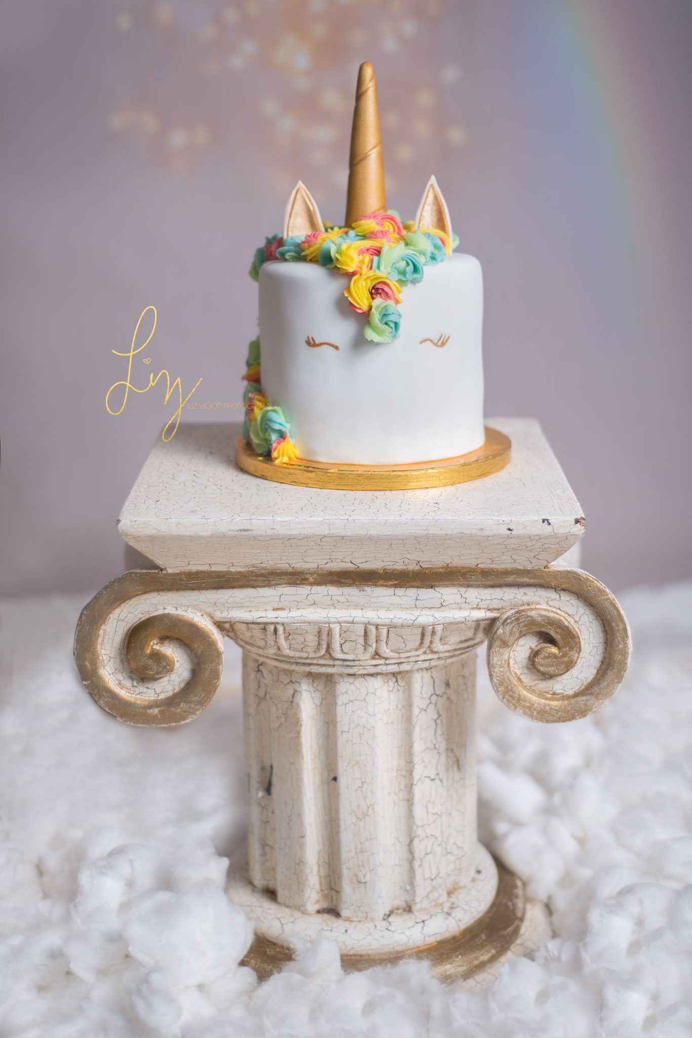 Rainbow cloud unicorn themed Essex cake smash - Liz Wood Photography
