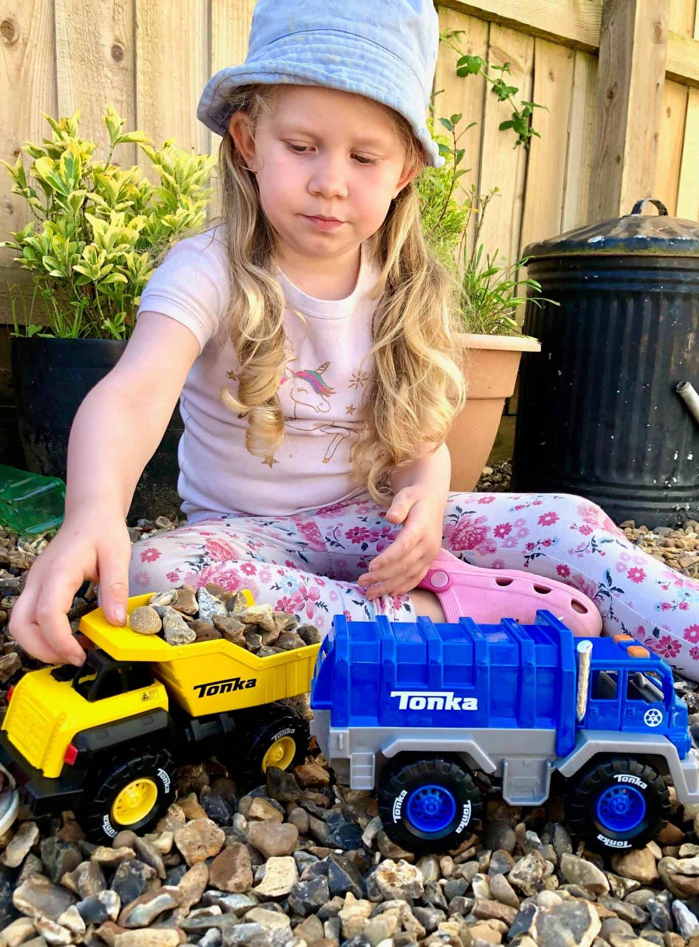 L playing with the Tonka Trucks