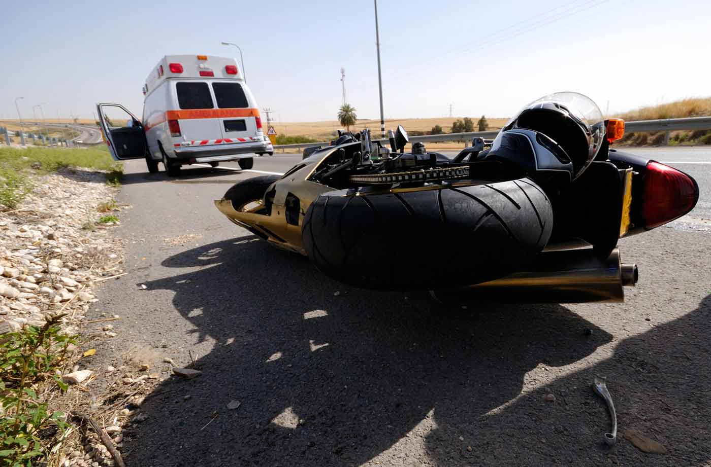 motorcycle on its side after an accident