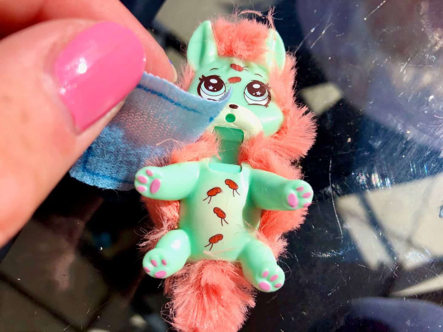 cleaning off the fleas - Scruff Surprise Vet Pet