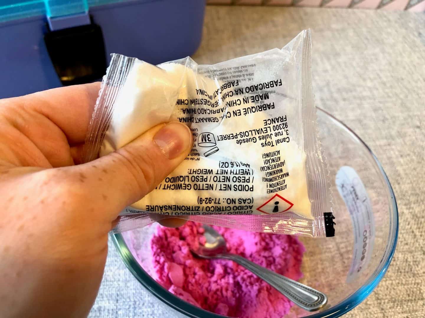 adding citric acid to the mixture to make the bath bomb