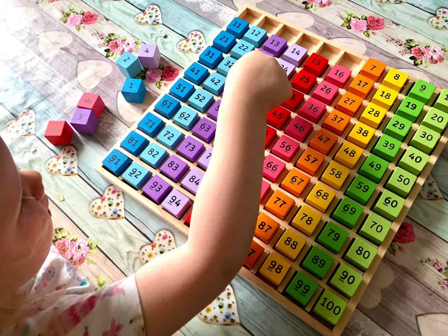 L-playing-with-her-number-tray