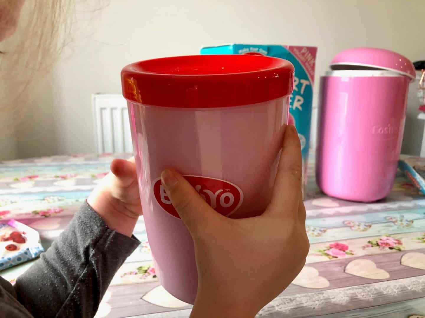 Shaking the yogurt mix in the jar