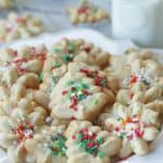 These classic Spritz Cookies are rich, buttery and a must-have cookie for Christmas. Rumor has it that they are Santa's favorite too. #SpritzCookies #ChrismtasCookies #CookieRecipe #holidaybaking #holidayrecipes #Christmascookieexchange #Christmascookierecipe