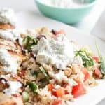 Pressure Cooker Mediterranean Brown Rice Bowls and Lemon Garlic Chicken with a dollop of tzatziki sauce