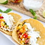fish tacos with peach corns alsa and basil crema