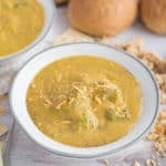 Broccoli Cheddar soup in a bowl with cheddar cheese on top