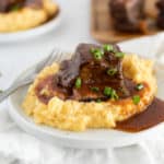 short ribs served over polenta with gravy over top