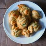 garlic bread rolls on white dinner plate