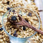 Homemade Granola in a glass with a spoon