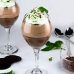 Mint Chocolate Pudding Parfaits. Easy chocolate pudding from scratch, topped with creamy chocolate mousse, layered with chocolate wafer cookies and topped with peppermint whipped cream!