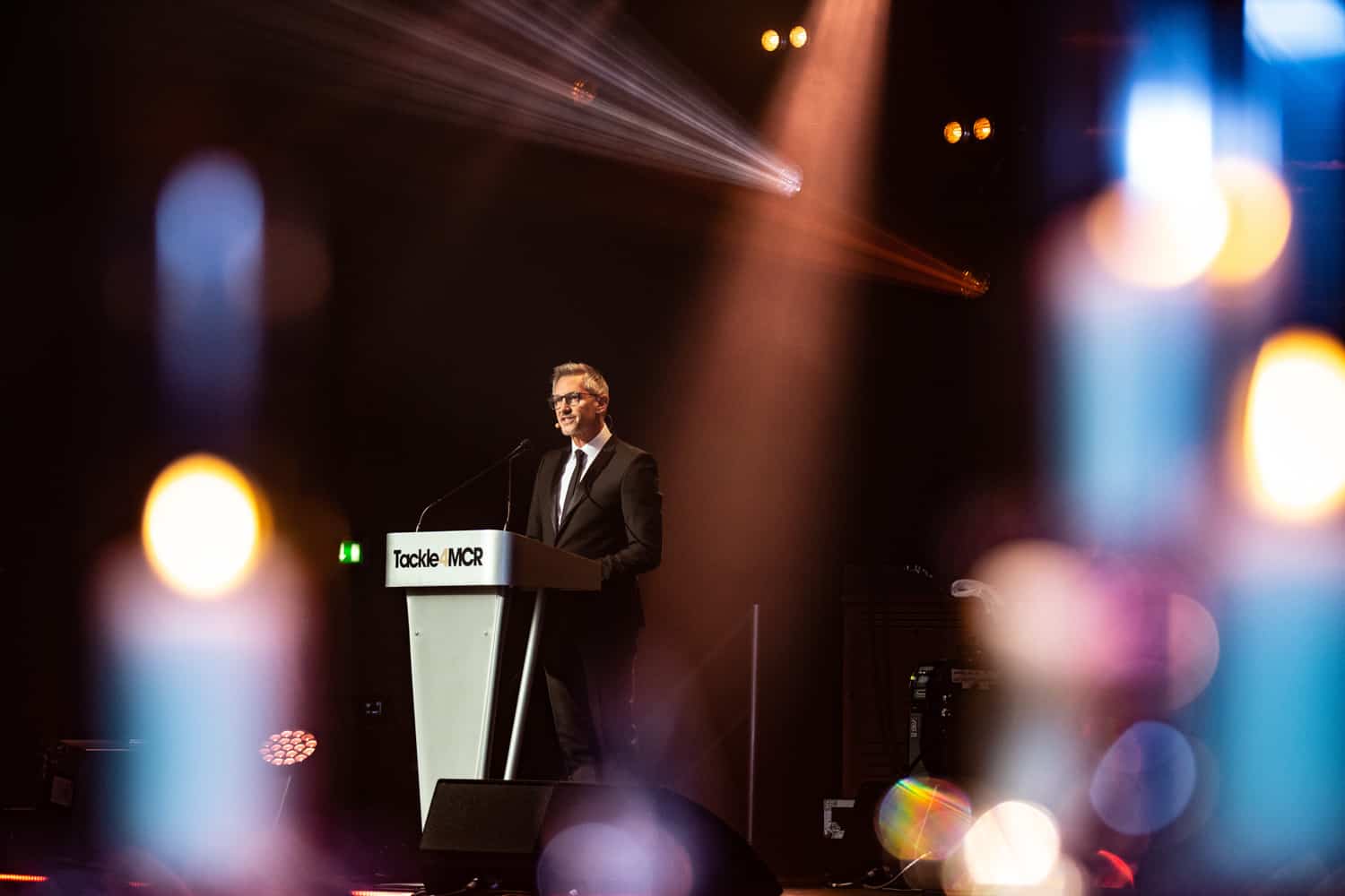 Corporate and conference photographer based in manchester this is gary linkaer presenting at the tackle for manchester awards in 2019