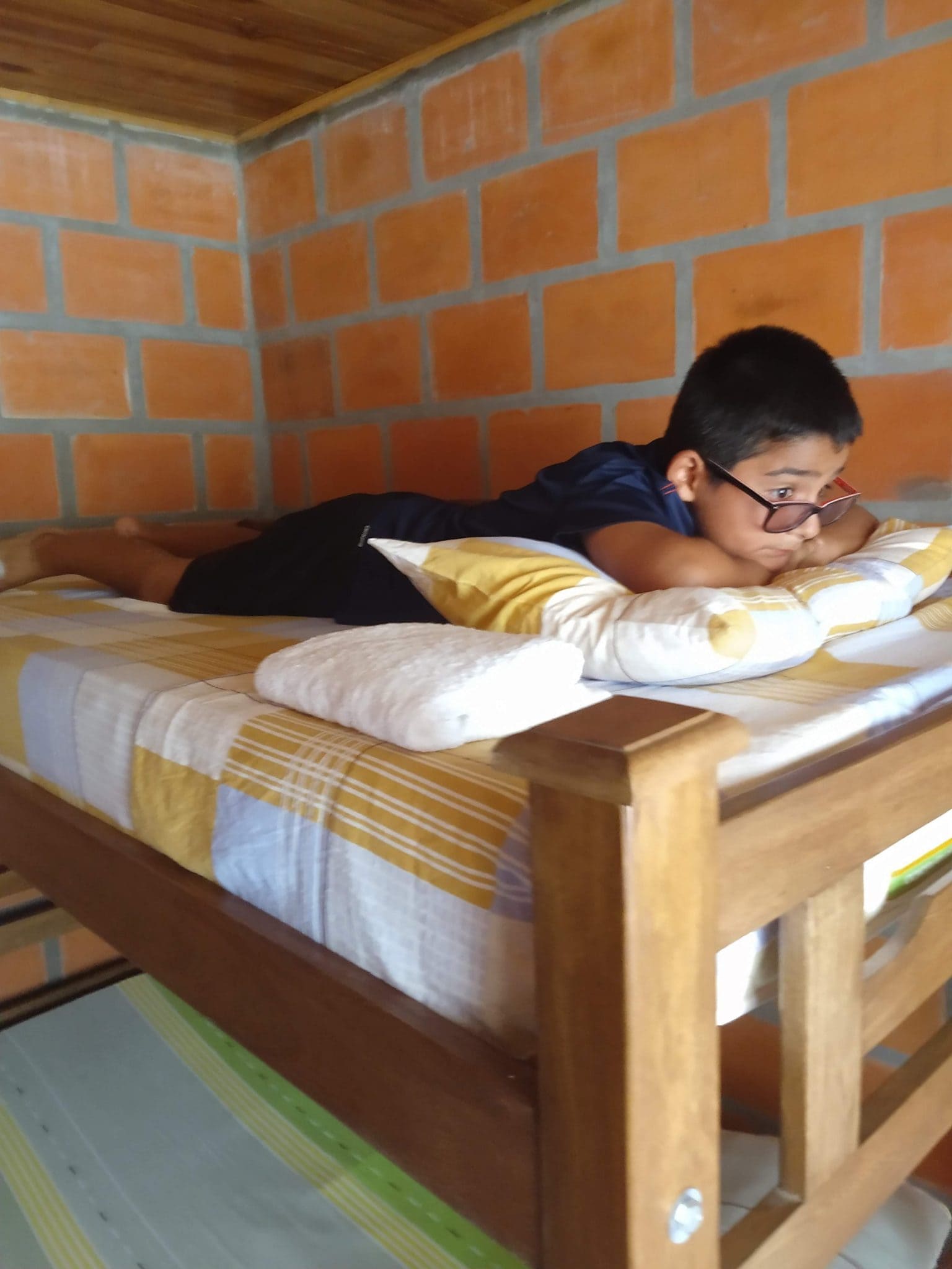 Our Two Wonderful Nights in Minca, Colombia 5 Mateo lying on his bed at Cabanas el Descanso y Zamukia