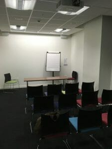 Initial presentation se-up with a "Presenters' Table" at the front