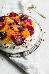 A light and fluffy Winter Citrus Pavlova that's basically a giant meringue topped with whipped cream and juicy winter citrus fruits. Oh baby.