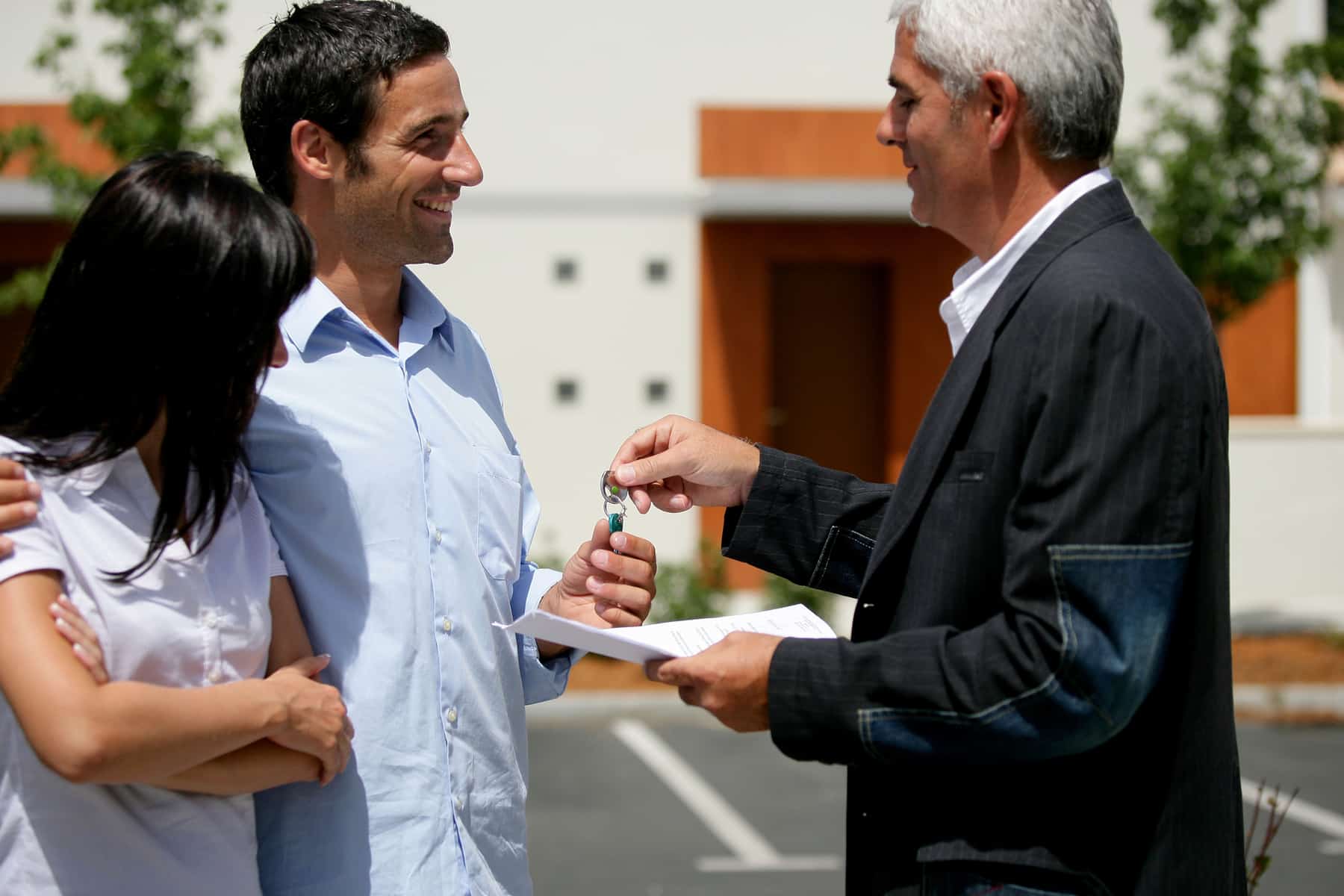 Couple receiving the keys to their new apartment Couple receiving the keys to their new apartment