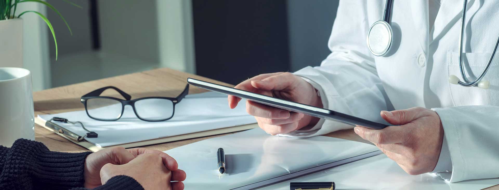 A Doctor Reading A Chart
