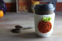 This adorable Crochet Pumpkin Applique is so easy and makes a perfect gift. I have one on a coffee cozy and one on a beanie for the new baby. It would also be cute on a crochet ear warmer headband.