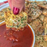 Baked Parmesan Crusted Ravioli Bites - the perfect game-day gathering or party finger food that you can enjoy without the guilt of traditional fried ravioli! Super crispy on the outside, yet cheesy on the inside. Easy to make! #ravioli #appetizers #baked #gameday | https://withpeanutbutterontop.com