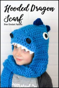 Crochet this easy and detail filled Hooded Dragon scarf. It is complete with claws, spikes, nostrils, eyes and teeth. This free crochet pattern uses only basic stitches and works up quick and easy. It is a great pattern for beginners that uses clever sewing methods to create a lot of fun details. #crochet #dragoncrochet #crochetdragon