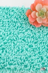 The crochet loop stitch is a beautiful stitch that makes loops while crocheting a fabric. Follow the video to photo tutorial to learn this unique crochet stitch. #crochetstitch #stitchtutorial